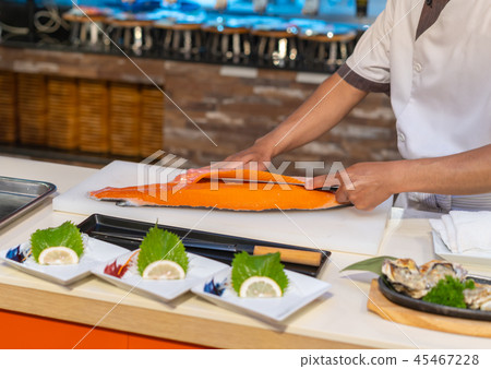 chef cutting salmon for Sashimi, Japanese food chef cutting salmon for Sashimi, Japanese food 45467228