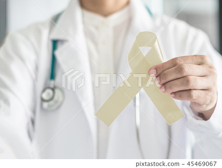 Cream awareness ribbon  in doctor hand support  45469067