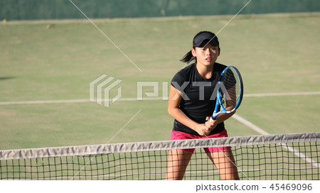 Junior tennis player holding a volley 45469096