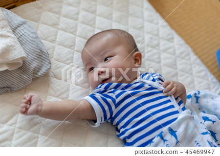 Smiling newborn baby 45469947