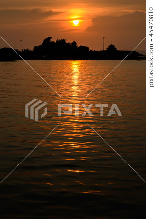 Nice suset sky at sea with island silhouette Nice suset sky at sea with island silhouette 45470810