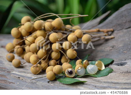 Fresh longan isolated on wooden background 45470886