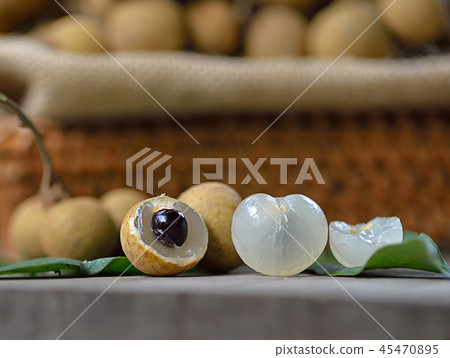 Fresh longan isolated on wooden background 45470895
