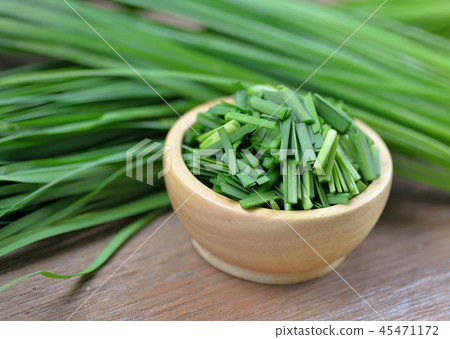 beautiful green onion chives on background. 45471172