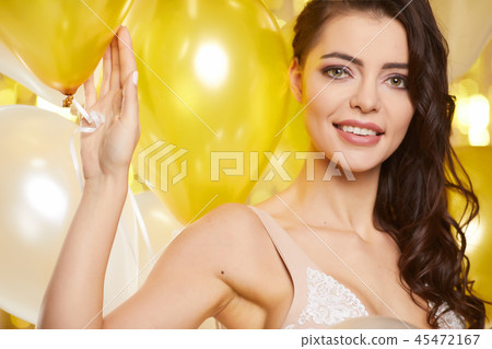 Beauty woman in gold dress . new year concept Beauty woman in gold dress . new year concept 45472167
