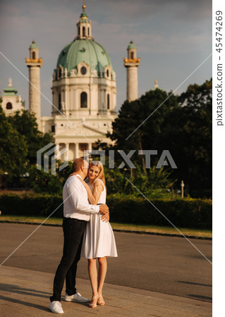 Happy couple walking around the city by the park Black and white clothes 45474269