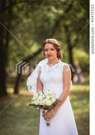 portrait of a young bride with wedding bouquet portrait of a young bride with wedding bouquet 45475583