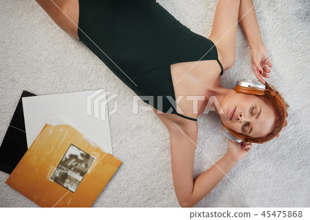 the image of resting sexy woman listening to vinyl the image of resting sexy woman listening to vinyl 45475868