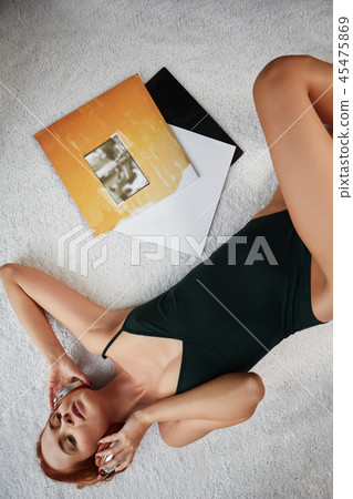 the image of resting sexy woman listening to vinyl 45475869