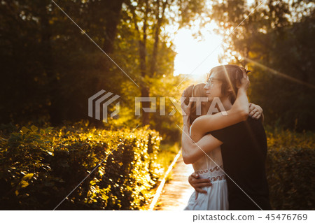 guy and the girl embracing on a background of park 45476769