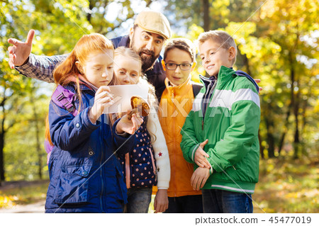 Serious red haired girl wanting to take a photo Serious red haired girl wanting to take a photo 45477019