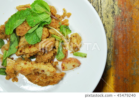spicy crispy fried chicken salad on dish 45479240