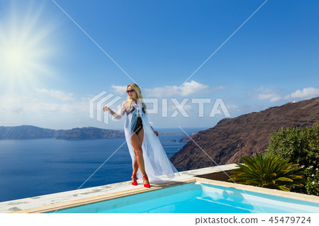 Beautiful woman by the sea Beautiful woman by the sea 45479724