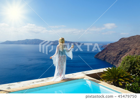 Beautiful woman by the sea Beautiful woman by the sea 45479750