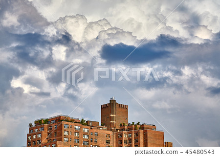 Dramatic cloudscape over building in New York. Dramatic cloudscape over building in New York. 45480543