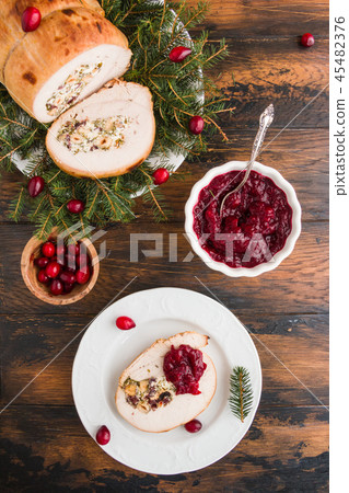 Stuffed turkey breast roll with cranberry sauce Stuffed turkey breast roll with cranberry sauce 45482376