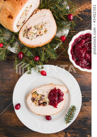 Stuffed  turkey breast roll with cranberry sauce 45482381