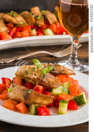 Tilapia fish fillet marinated in ginger and garlic 45482385