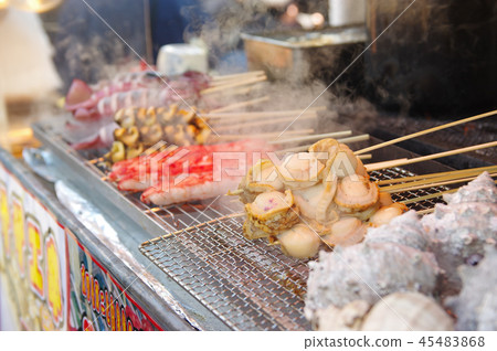 Seafood skewer on a steamy festoon Seafood skewer on a steamy festoon 45483868