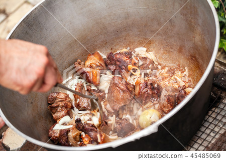 Mixing boiled lamb and vegetables Mixing boiled lamb and vegetables 45485069