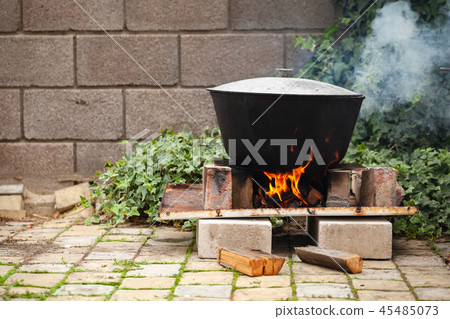 Cauldron boiling on bonfire Cauldron boiling on bonfire 45485073