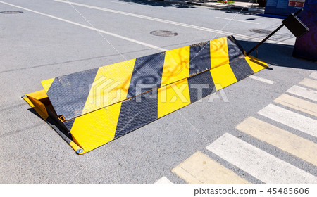 Road barrier with yellow and black striped Road barrier with yellow and black striped 45485606