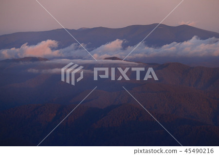 Smoke from the main mountain hut just below the summit of Tohoku Itoyoyama in the morning glow Smoke from the main mountain hut just below the summit of Tohoku Itoyoyama in the morning glow 45490216