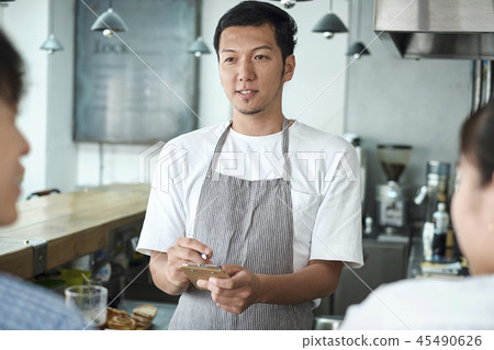 Staff working at a cafe Staff working at a cafe 45490626