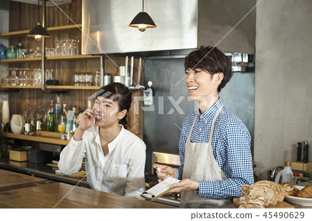 Staff working at a cafe Staff working at a cafe 45490629