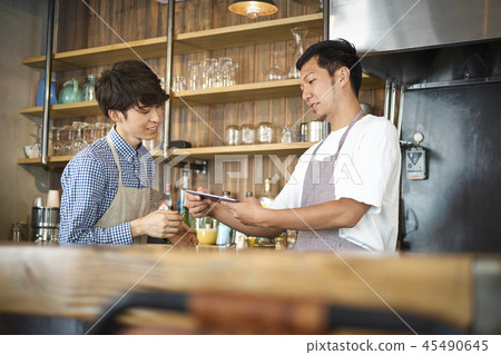 Staff working at a cafe Staff working at a cafe 45490645