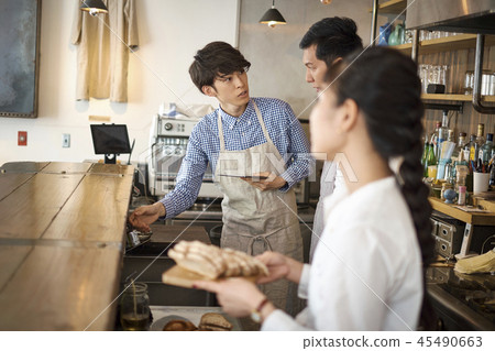 Staff working at a cafe Staff working at a cafe 45490663