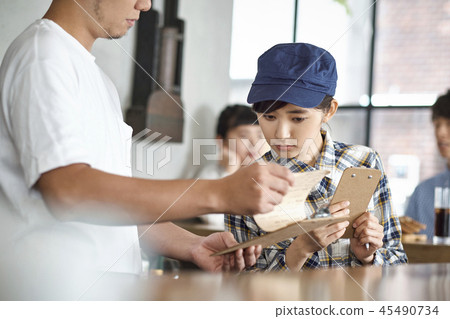 Staff working at a cafe 45490734