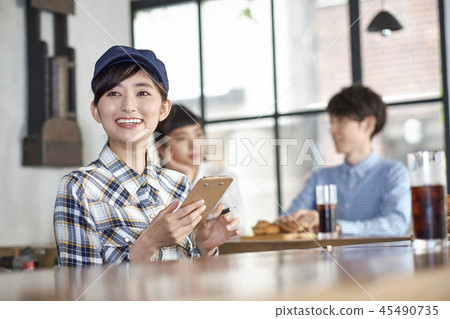 Staff working at a cafe 45490735