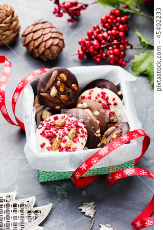 Luxury handmade chocolate mediants, cookies, bites in gift box Traditional french Christmas dessert 45492233