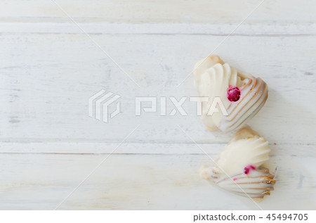 Couple of cookies on white wooden board. Heart shape. Valentine conception. Couple of cookies on white wooden board. Heart shape. Valentine conception. 45494705