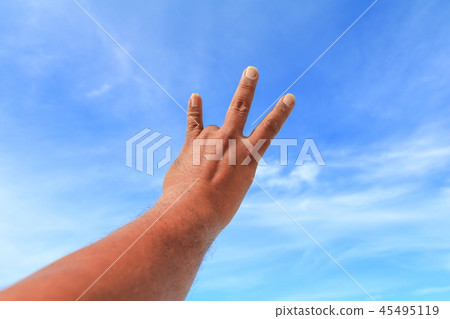 hand show counting number three sky background 45495119