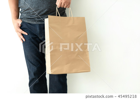 Consumer pack product Man shows bag mock up Consumer pack product Man shows bag mock up 45495218