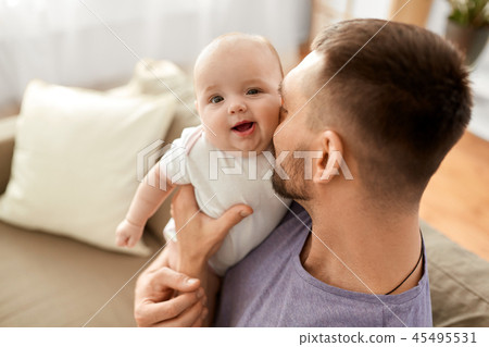 close up of father with little baby girl at home 45495531
