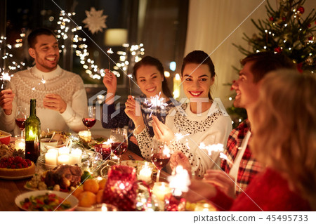 happy friends celebrating christmas at home feast happy friends celebrating christmas at home feast 45495733