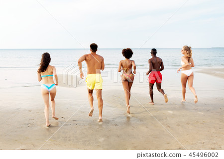 happy friends running on summer beach happy friends running on summer beach 45496002
