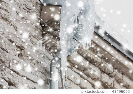 icicles hanging from building drainpipe icicles hanging from building drainpipe 45496003