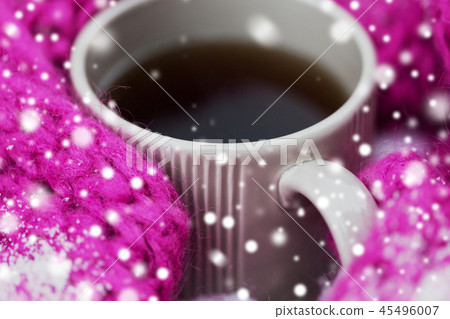 close up of tea or coffee and winter scarf in snow close up of tea or coffee and winter scarf in snow 45496007