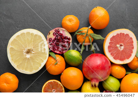 close up of citrus fruits on stone table close up of citrus fruits on stone table 45496047