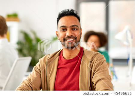 smiling indian man at office smiling indian man at office 45496655