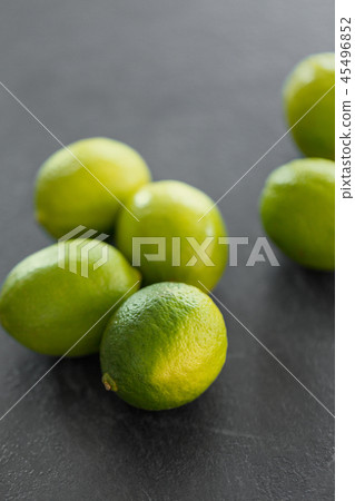 close up of whole limes on slate table top close up of whole limes on slate table top 45496852