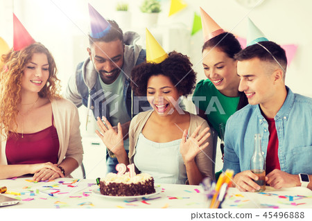 team greeting colleague at office birthday party 45496888