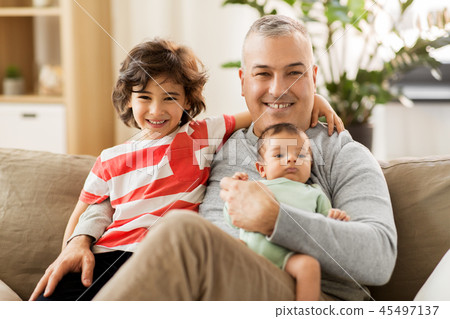 happy father with preteen and baby son at home 45497137
