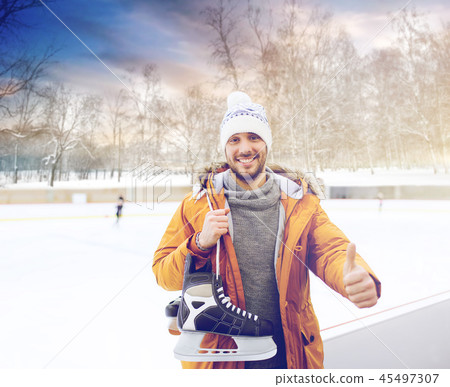 happy young man showing thumbs up on skating rink happy young man showing thumbs up on skating rink 45497307