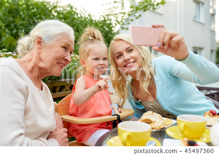 happy family taking selfie at cafe 45497360