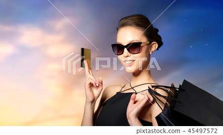 happy woman with credit card and shopping bags happy woman with credit card and shopping bags 45497572